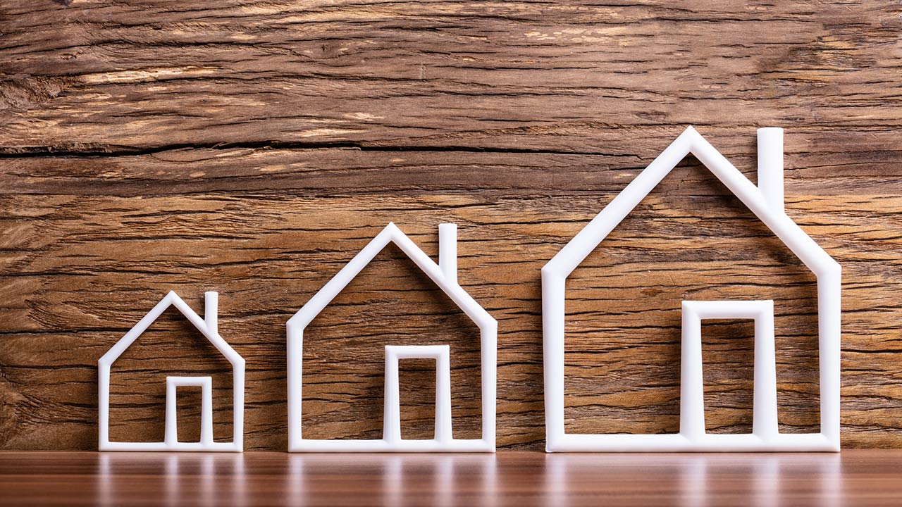 Increasing White Outlined Houses Against Rustic Background