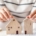 woman is deciding to choose house with Small Wooden House Model