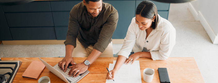 Couple calculating budget, finance and tax while planning investment, loan and bills at home from above