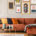 Eclectic living room interior with comfortable velvet corner sofa with pillows stock photo